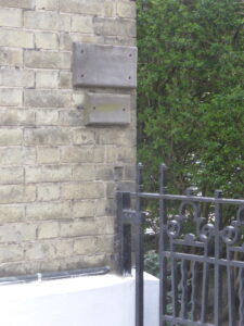 Old plaques on the corner of Brackley House in 2019, possibly residual from when it was used as a surgery and where there would have been brass plaques attached? (see below or click image for source and acknowledgements etc., ref. Image 2).