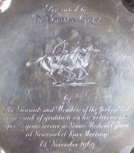 Central section of a salver presented to Norman Gray by the Jockey Club in 1969, when he stepped down as their Senior Medical Officer at Newmarket race meetings after 25 years of service (see below or click image for source and acknowledgements etc., ref. Image 2).