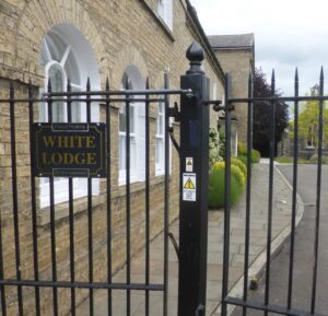 The side entrance to part of the White Lodge residential accommodation today, with a 'White Lodge' sign on the railings outside - the street sign nearby also says 'Heasman Close leading to White Lodge' - see also the page on the Newmarket Union and workhouse for a view of this old workhouse building from the front taken at the same time as the photograph above (see below or click image for source and acknowledgements etc., ref. Image 4).